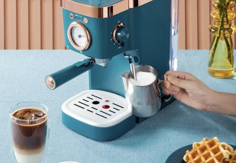 Person using espresso machine to froth milk for coffee.