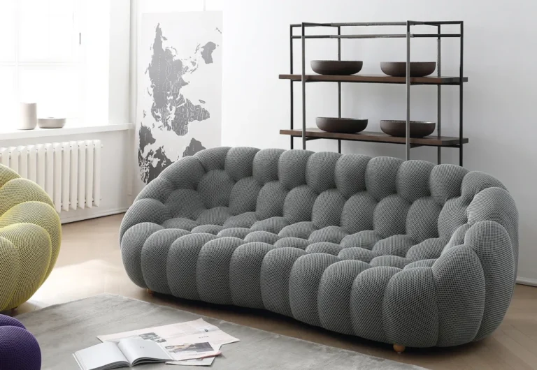 Modern tufted sofa in stylish minimalist living room.