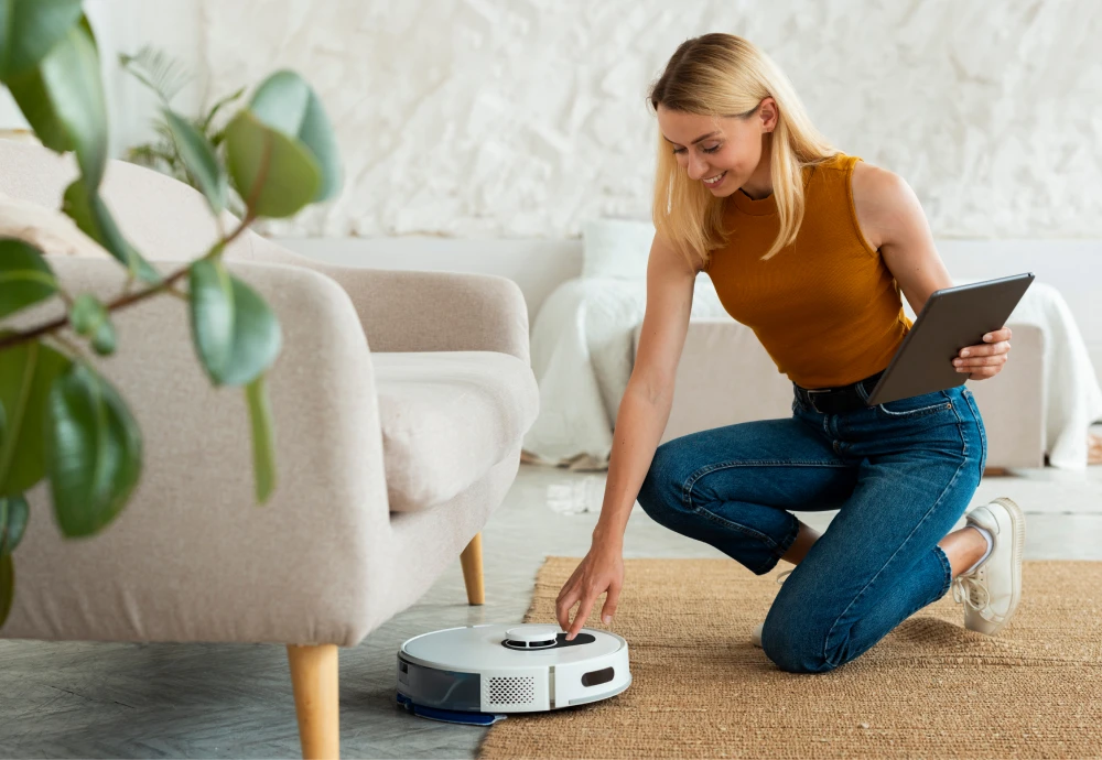Woman using tablet controls robotic vacuum in living room.